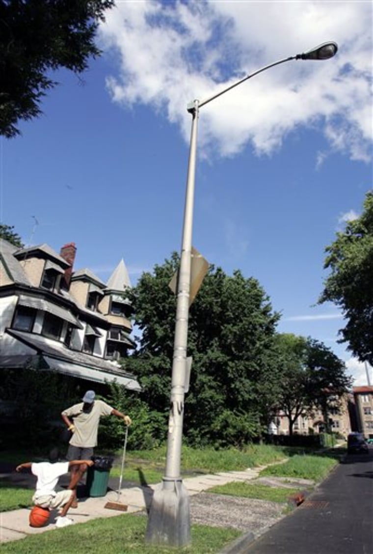A small box housing a gunshot sensor can be seen mounted near the top of a light pole on Lenox Avenue, in East Orange, N.J. 